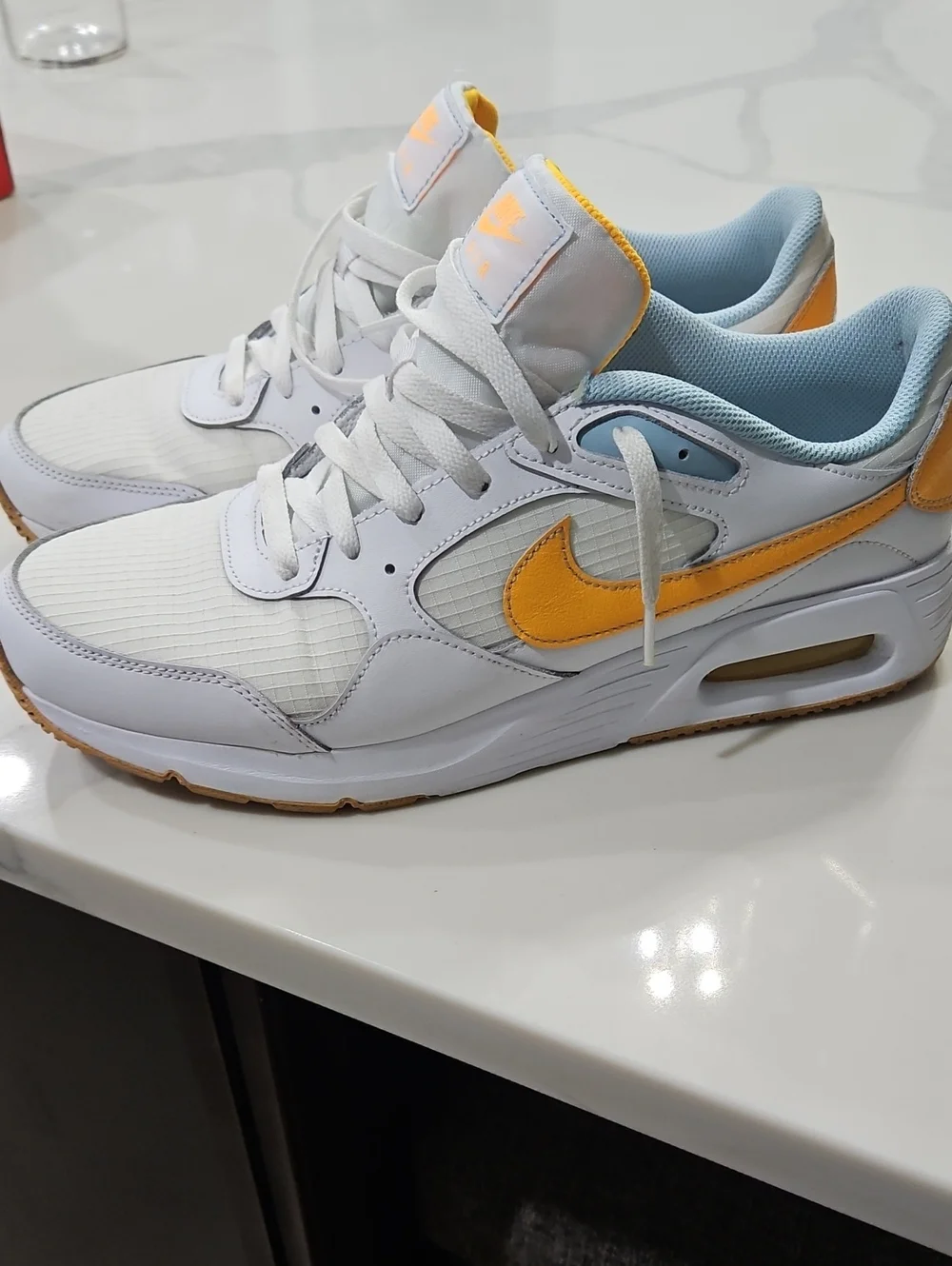 Nike AIR White Sneakers with Yellow Swoosh and Light Blue Lining